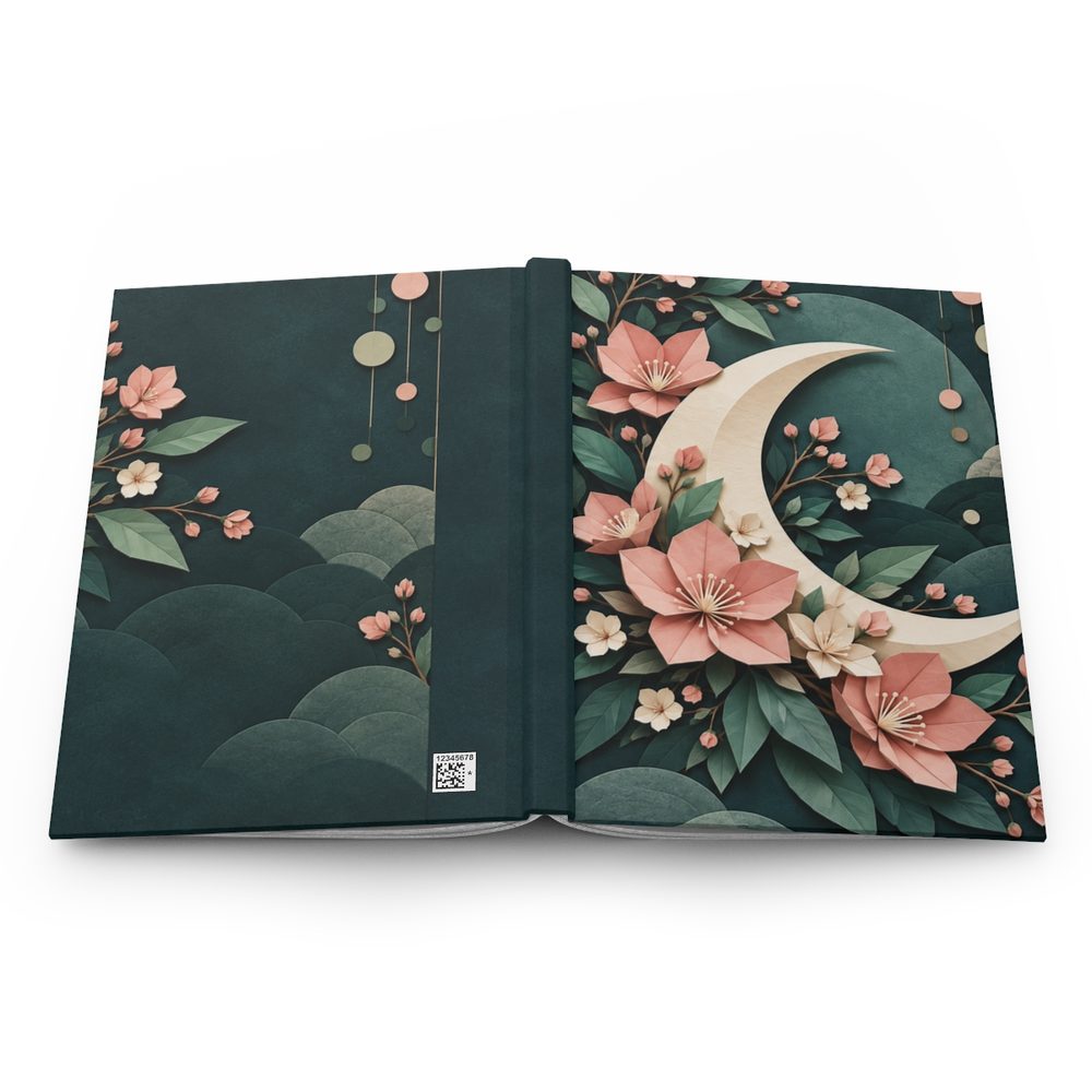 Origami Moon Garden hardcover journal shown open flat, paper-fold flowers around a large crescent moon in dusty pink on deep jade wrapping across the front, spine and back cover