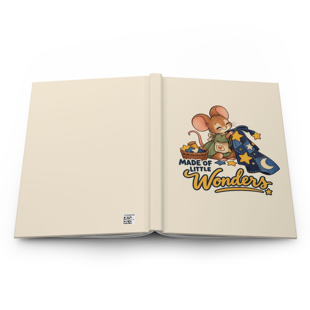 Star Stitcher hardcover journal shown open flat, a smiling mouse stitching a navy quilt of gold stars beside a sewing basket above the words Made of Little Wonders on the front cover, with a cream spine and back