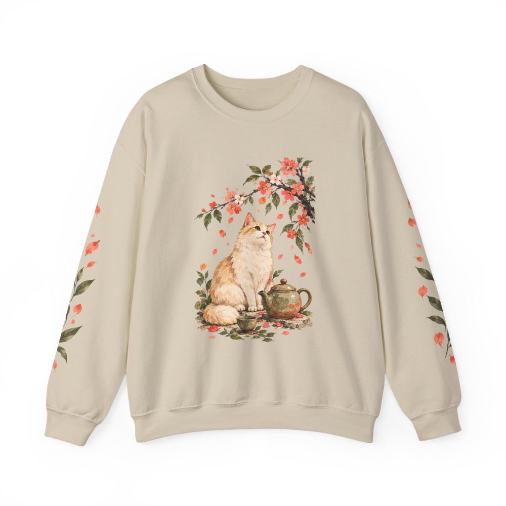 Cat and Teapot crewneck sweatshirt in sand, a cream cat sitting beside a teapot under a flowering branch on the front with matching prints down both sleeves
