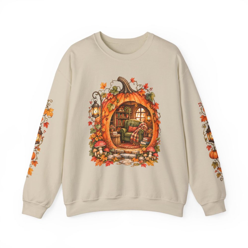 Pumpkin Reading Nook crewneck sweatshirt in sand, a pumpkin cottage with a cozy reading nook, books and autumn leaves on the front with matching prints down both sleeves