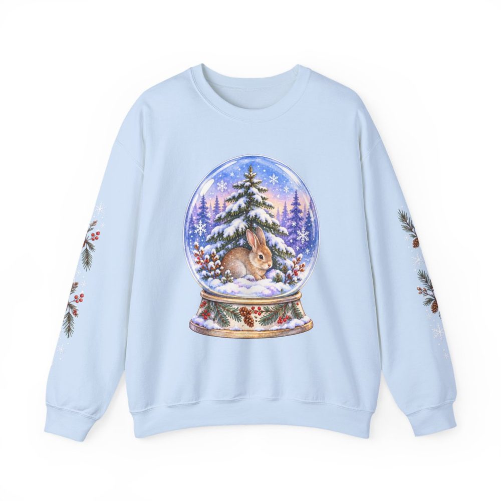 Woodland Rabbit Snow Globe crewneck sweatshirt in light blue, a snow globe holding a resting rabbit beneath a snowy pine tree on the front with matching prints down both sleeves