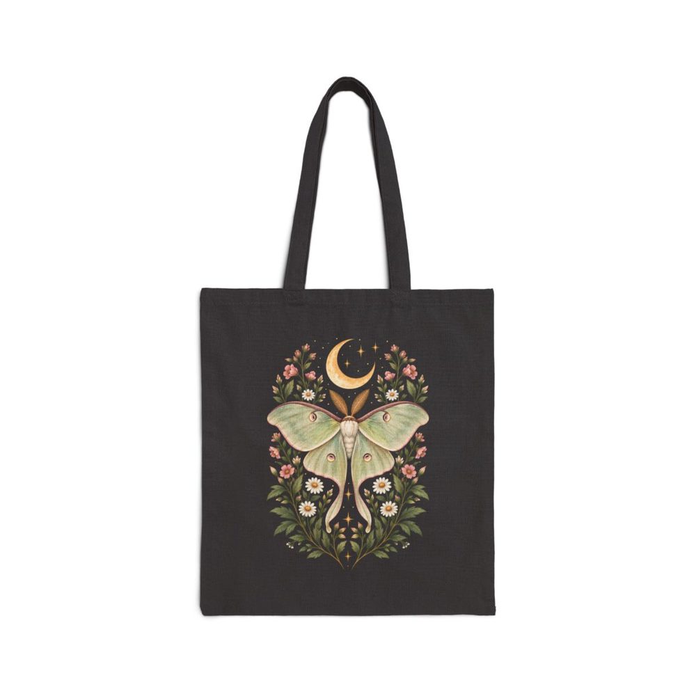 Luna Moth and Daisy tote bag in black cotton canvas, printed with a pale green luna moth above daisies and wildflowers under a crescent moon