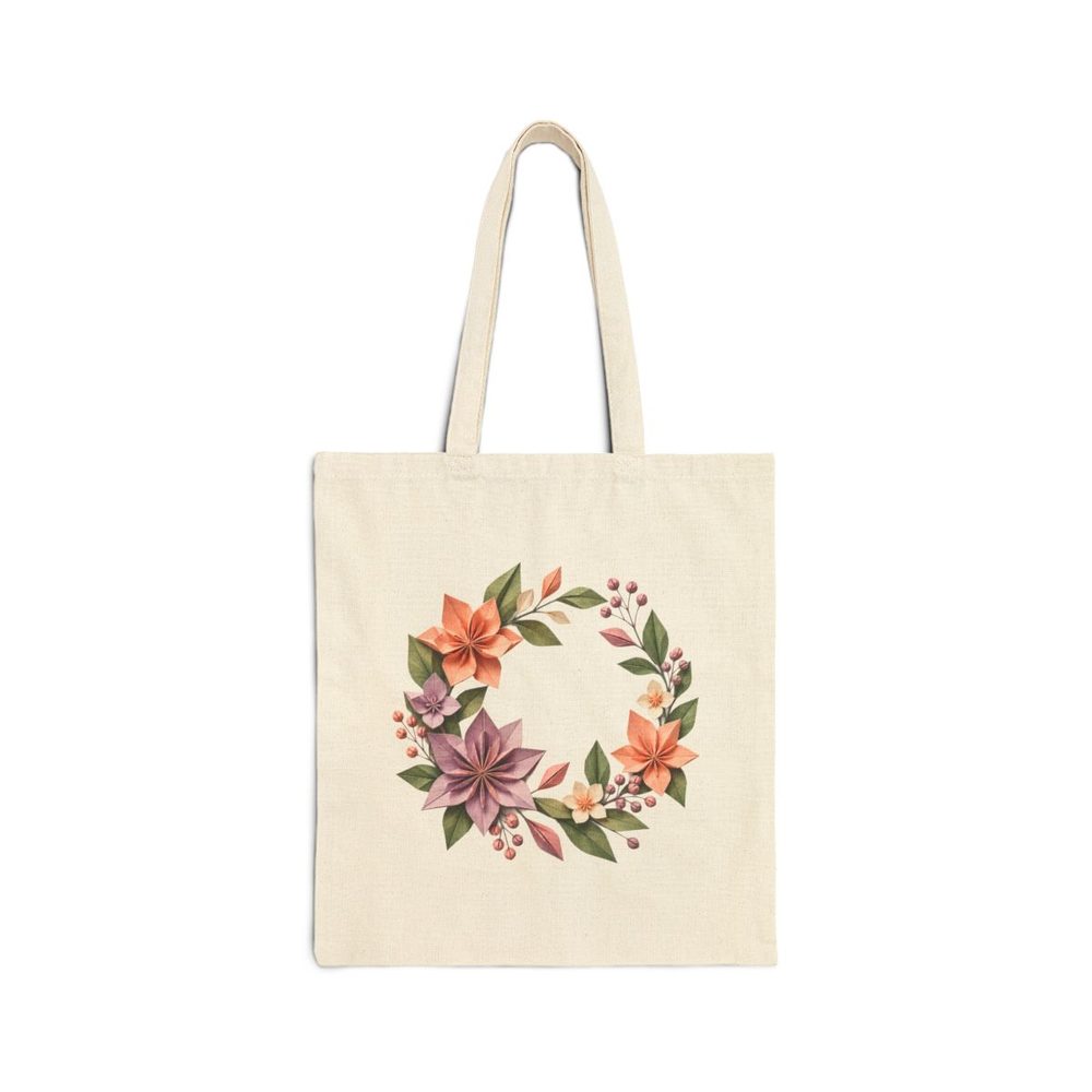 Paper Flower Garden tote bag in natural cotton canvas, printed with a wreath of folded-paper flowers in dusty lilac, apricot and sage