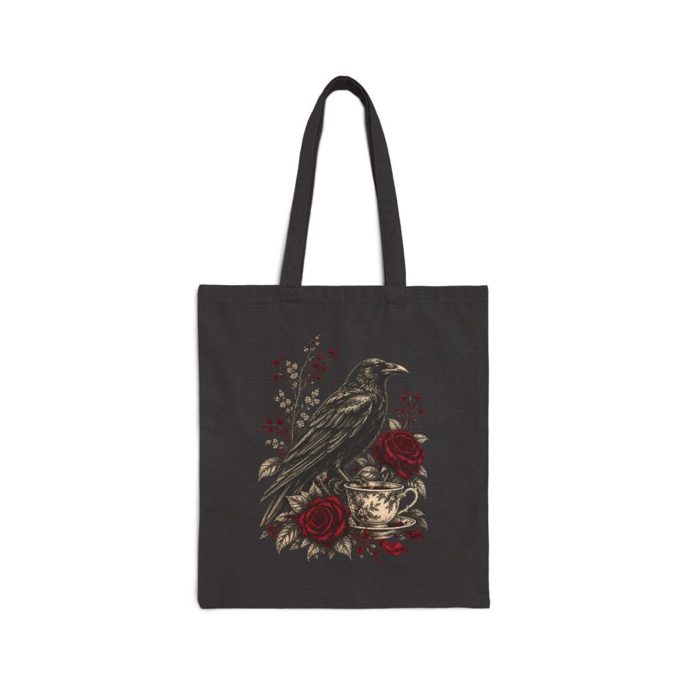 Raven and Teacup tote bag in black cotton canvas, printed with a black raven perched over an antique teacup among red roses